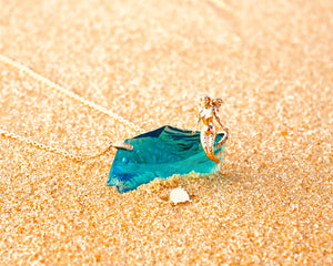 For many the Awakening story starts with remembering Lemuria, its mermaid, dolphins ....  14k Mermaid sitting atop an electric blue Andara, on an 18K gold necklace with diamonds holders.