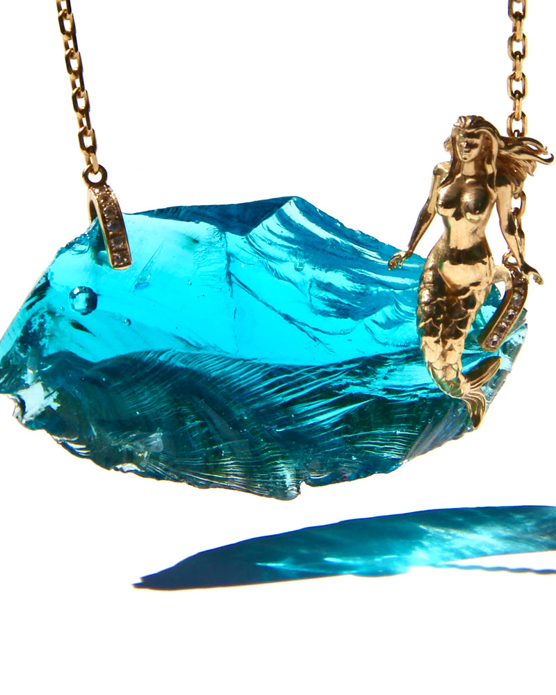 For many the Awakening story starts with remembering Lemuria, its mermaid, dolphins ....  14k Mermaid sitting atop an electric blue Andara, on an 18K gold necklace with diamonds holders.