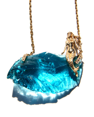 For many the Awakening story starts with remembering Lemuria, its mermaid, dolphins ....  14k Mermaid sitting atop an electric blue Andara, on an 18K gold necklace with diamonds holders.