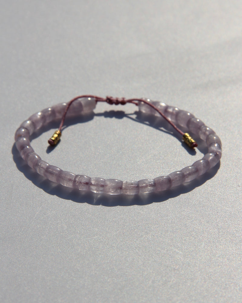 The Healer's bracelet , Kunzite mini.  Small kunzite beads with two 24K gold beads, with circles pattern (symbols of the Core , the center of the Higher Heart) drawn on them.