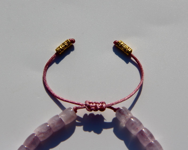 The Healer's bracelet , Kunzite mini.  Small kunzite beads with two 24K gold beads, with circles pattern (symbols of the Core , the center of the Higher Heart) drawn on them.