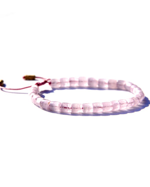 The Healer's bracelet , Kunzite mini.  Small kunzite beads with two 24K gold beads, with circles pattern (symbols of the Core , the center of the Higher Heart) drawn on them.