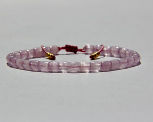 The Healer's bracelet , Kunzite mini.  Small kunzite beads with two 24K gold beads, with circles pattern (symbols of the Core , the center of the Higher Heart) drawn on them.