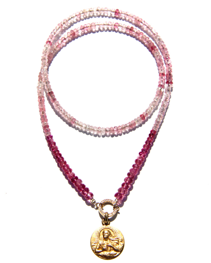 Pink tourmaline and rubellite necklace with an 18k yellow gold and white diamond clicker that can be opened to add more pendants. On the clicker an 18k yellow gold medal of the Divine feminine. Tourmaline and rubellite are stone vibrating at Divine Love frequency.  The necklace will rest on the higher Heart chakra.