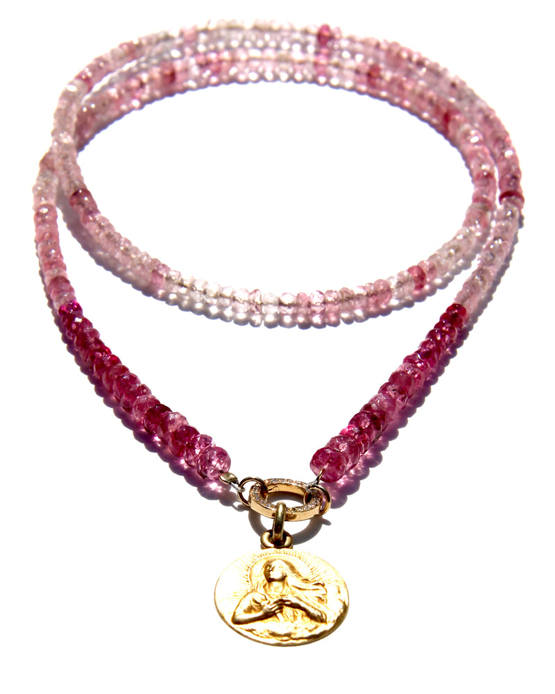 Pink tourmaline and rubellite necklace with an 18k yellow gold and white diamond clicker that can be opened to add more pendants. On the clicker an 18k yellow gold medal of the Divine feminine. Tourmaline and rubellite are stone vibrating at Divine Love frequency.  The necklace will rest on the higher Heart chakra.