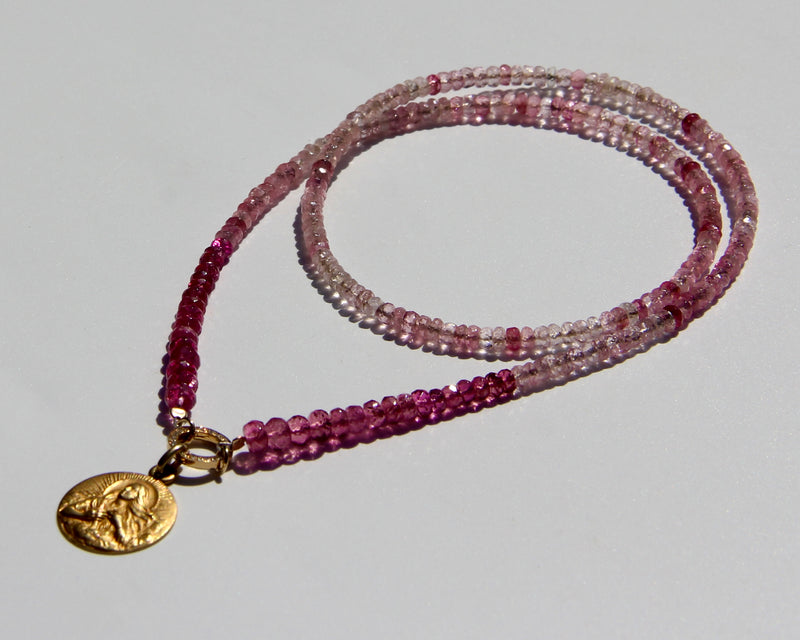 Pink tourmaline and rubellite necklace with an 18k yellow gold and white diamond clicker that can be opened to add more pendants. On the clicker an 18k yellow gold medal of the Divine feminine. Tourmaline and rubellite are stone vibrating at Divine Love frequency.  The necklace will rest on the higher Heart chakra.