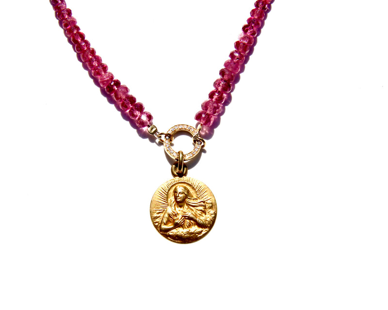 Pink tourmaline and rubellite necklace with an 18k yellow gold and white diamond clicker that can be opened to add more pendants. On the clicker an 18k yellow gold medal of the Divine feminine. Tourmaline and rubellite are stone vibrating at Divine Love frequency.  The necklace will rest on the higher Heart chakra.