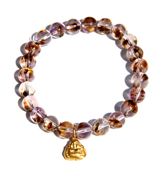 Stretch bracelet, beads made of Cacoxenite Amethyst.   Each beads has wisps of golden cacoxenite. The beads are crystal clear and full of Light. This is truly a magnificent strandSmall 18k gold laughing Buddha.