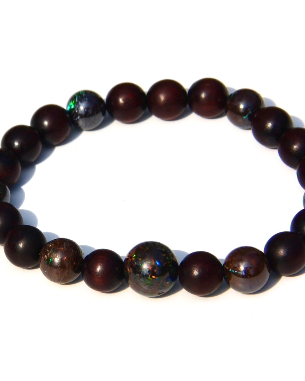 The Healer's bracelet with Sandalwood beads and 7 matrix opal beads.  Each of the beds are pure sandalwood, and can be crushed and burned as pure incense.  The heat of your skin will develop the aroma of Sandalwood.