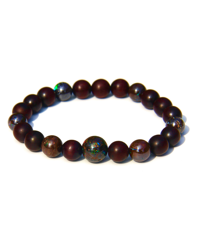 The Healer's bracelet with Sandalwood beads and 7 matrix opal beads.  Each of the beds are pure sandalwood, and can be crushed and burned as pure incense.  The heat of your skin will develop the aroma of Sandalwood.