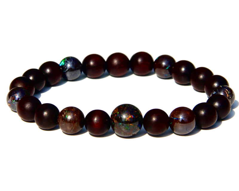 The Healer's bracelet with Sandalwood beads and 7 matrix opal beads.  Each of the beds are pure sandalwood, and can be crushed and burned as pure incense.  The heat of your skin will develop the aroma of Sandalwood.